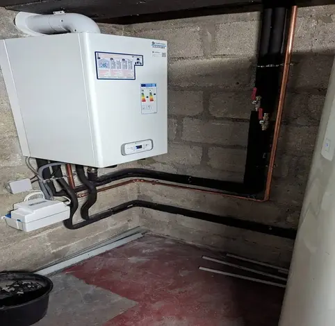 Installation d’une chaudière par un plombier Neuilly sur Marne dans une pièce technique
